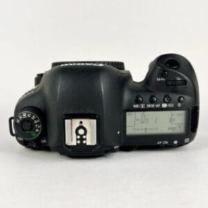 Digital camera top view with display screen.