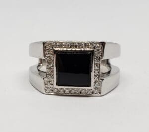 Silver ring with black square stone.