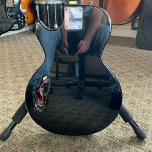 Back of a black electric guitar.