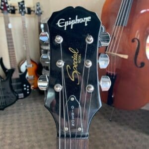 Epiphone guitar headstock with tuning pegs.