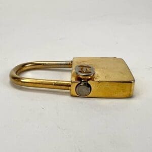 Gold padlock on white background.