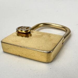 Golden padlock on a white background.