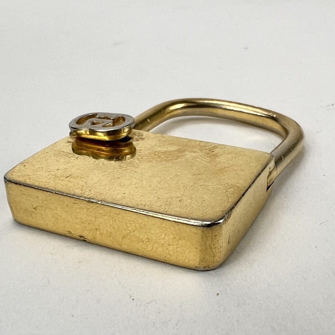 Golden padlock on a white background.