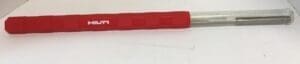 Red and silver tool on white surface.