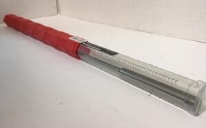 Red and silver serrated rod in packaging.