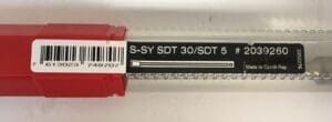 Red and clear plastic packaging with label.