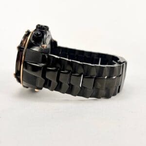 Black ceramic watch with linked band.