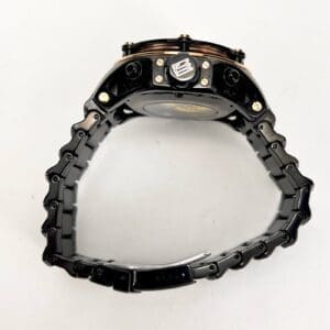 Black wristwatch with metallic strap.