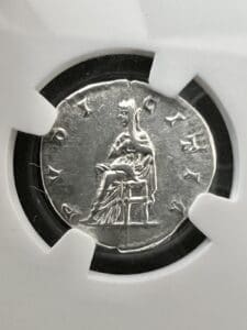 Ancient coin with seated figure design.