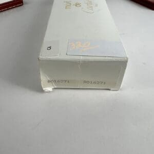 White box with product code and numbers.