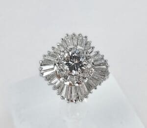 Diamond ring with intricate baguette halo.