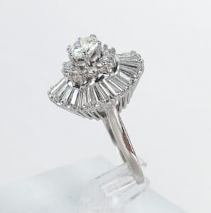 Diamond ring with baguette-cut accents.
