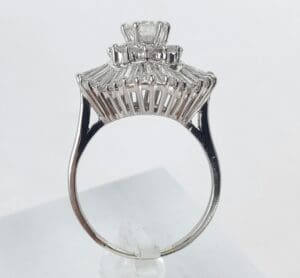 Silver ring with intricate diamond setting.