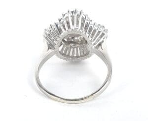 Silver ring with intricate design, rear view.