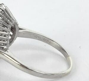 Silver ring with intricate band design.