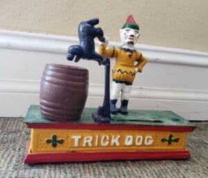 Vintage clown and dog mechanical bank.