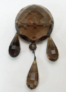 Brown crystal chandelier pendant with teardrop shapes.