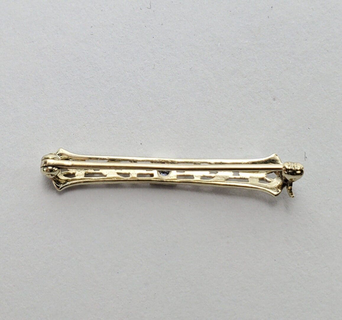Gold hair clip on white background.
