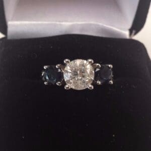 Diamond ring in black velvet box.