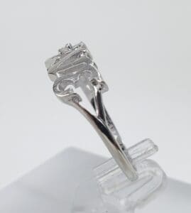 Silver ring with a unique, intricate design.