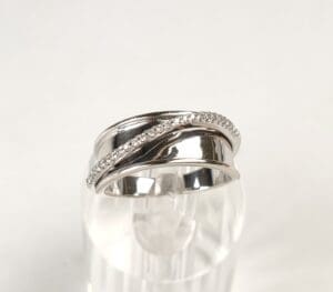 Silver ring with embedded sparkling stones.