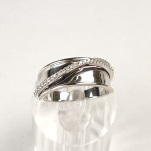 Silver ring with embedded sparkling stones.