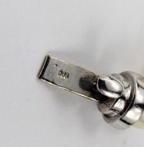 Close-up of a silver jewelry clasp.