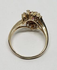 Gold ring with gemstone cluster setting.