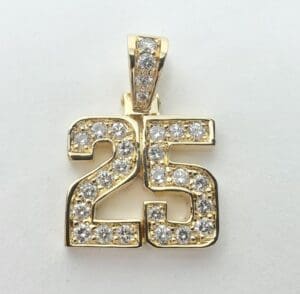 Gold pendant with diamond-studded number 25.