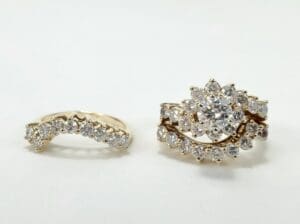 Diamond rings with intricate floral designs.