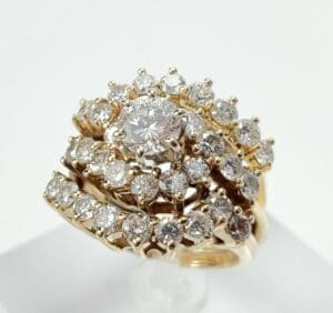 Gold ring with multiple sparkling diamonds.
