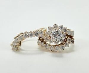 Gold ring with diamonds in floral design.