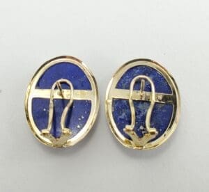 Gold and blue oval earrings, back view.