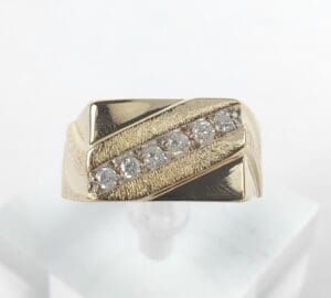 Gold ring with diagonal diamond design.