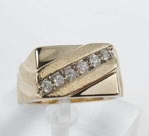 Gold ring with embedded diamonds.