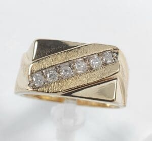 Gold ring with diagonal diamond row.