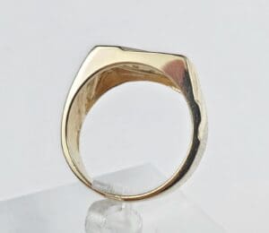 Gold ring with a unique geometric design.