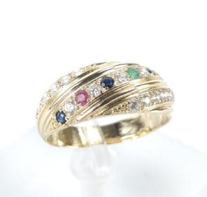 Gold ring with colorful gemstones and diamonds.