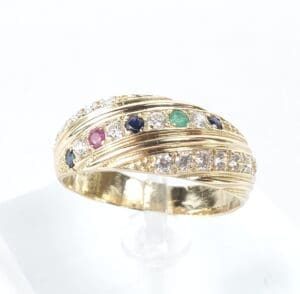 Gold ring with colorful gemstones and diamonds.