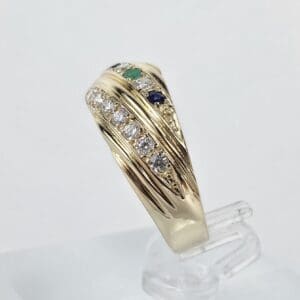 Gold ring with diamonds and colored stones.