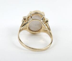 Gold ring with a large stone setting.