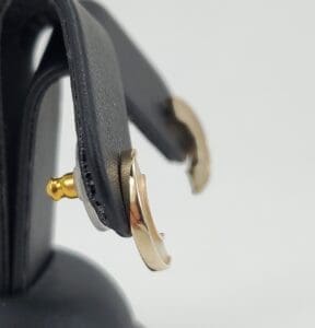 Gold and silver hoop earrings displayed.