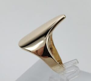 Gold ring with sleek, modern design.
