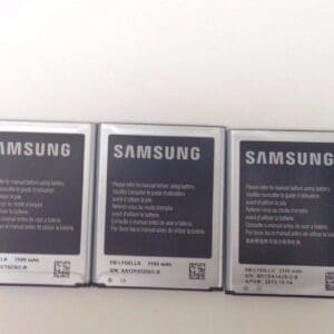 Three Samsung smartphone batteries on display.