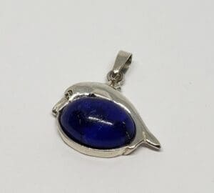Silver bird pendant with blue stone.
