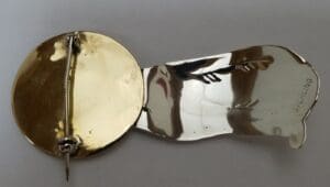 Gold and silver folding metal pin.