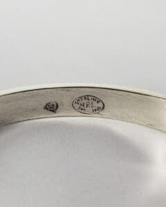 Silver bracelet with engraved hallmarks inside.