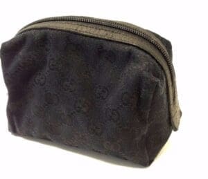 Black textured zippered pouch on white background.