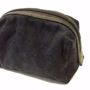 Black textured zippered pouch on white background.