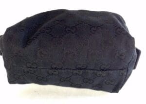 Black designer-patterned fabric pouch.